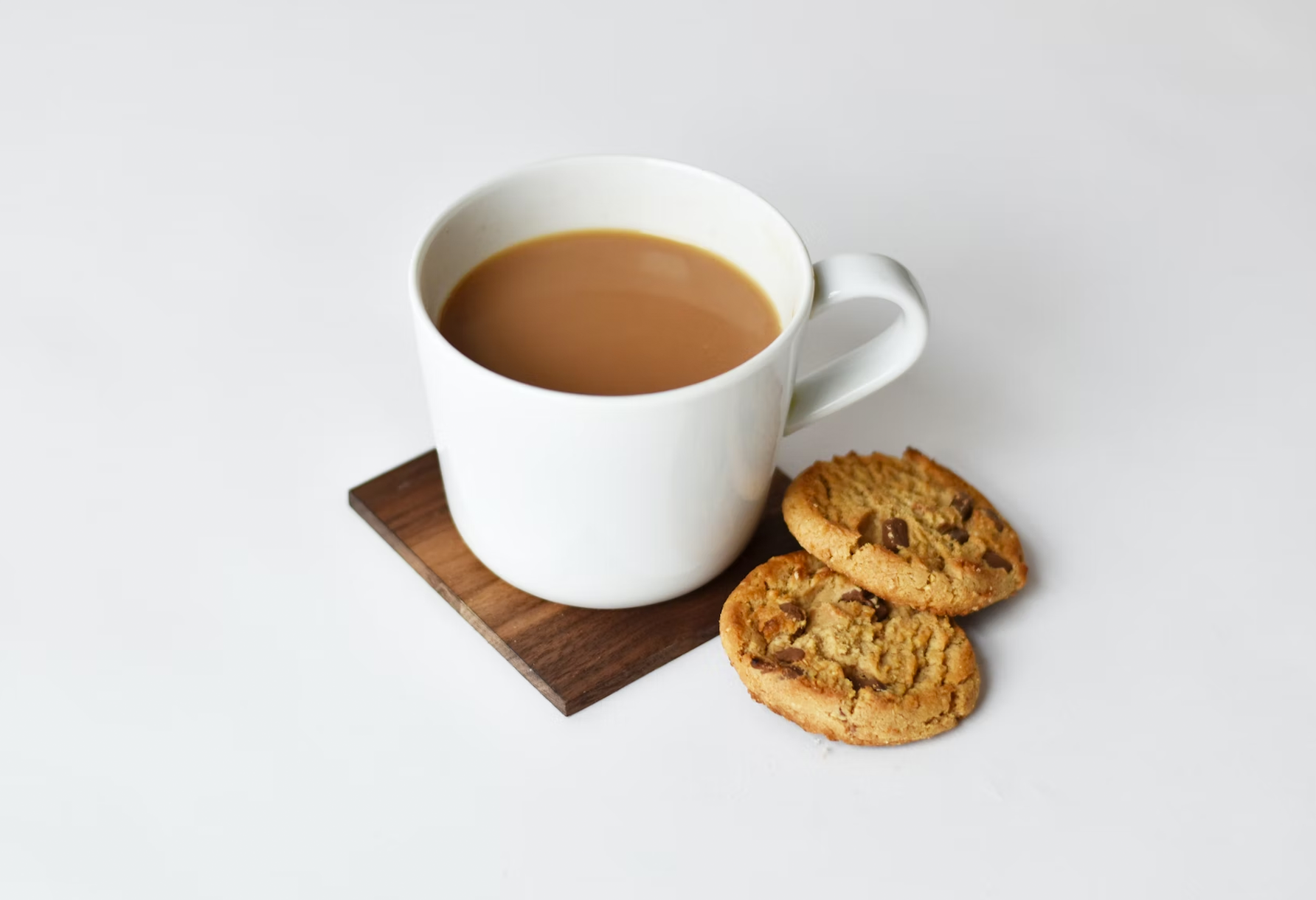 A cup of tea and a chocolate chip biscuit